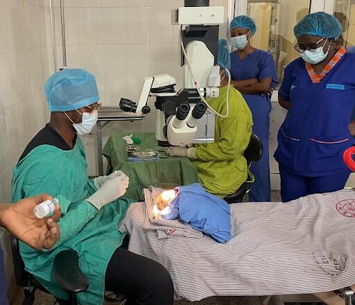 Dr. Dr. Akwasi Ahmed performing eye treatment in Ghana