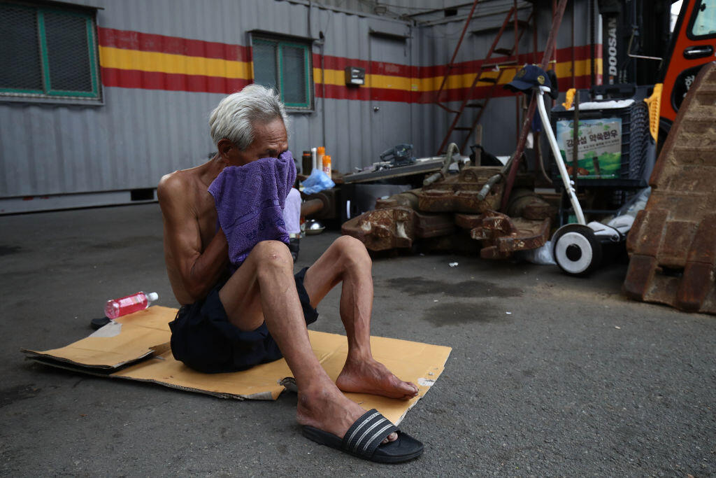 An elderly man in China during a heat wave