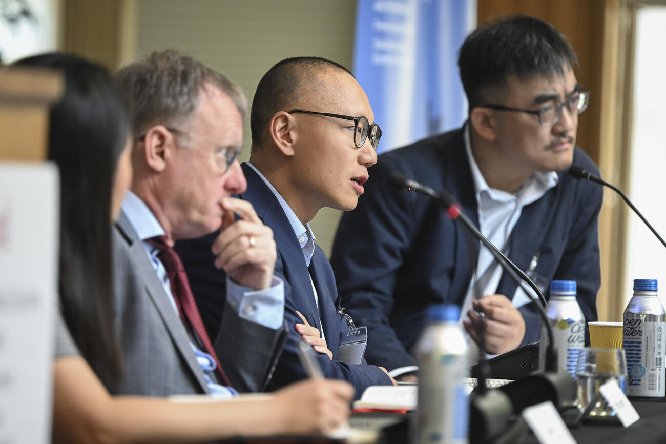Dan Wang sits on a panel with Zhiguo He and Arthur Kroeber.