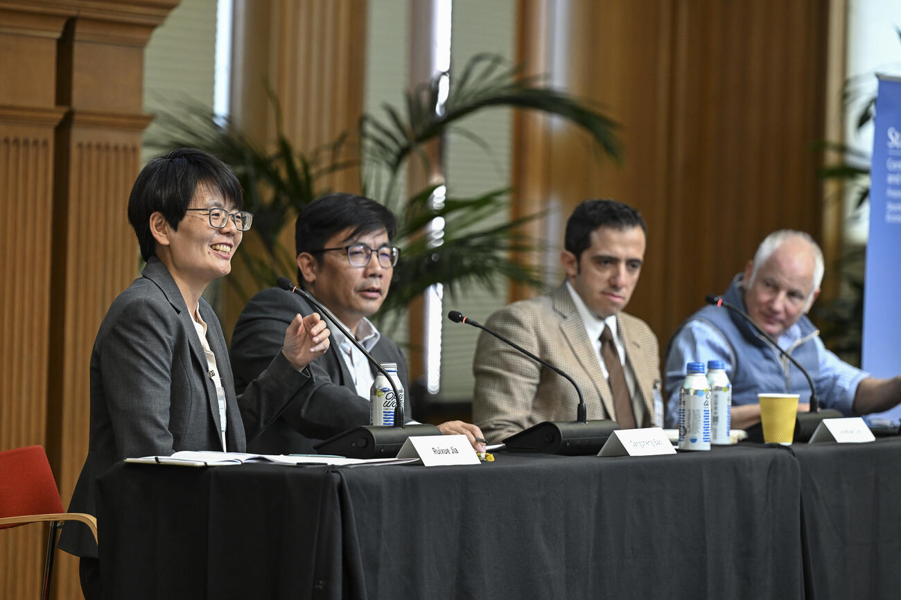 Ruixue Jia, Gaosheng Bao, Jonathan Czin, Arthur Kotkin sit on a panel at a conference.