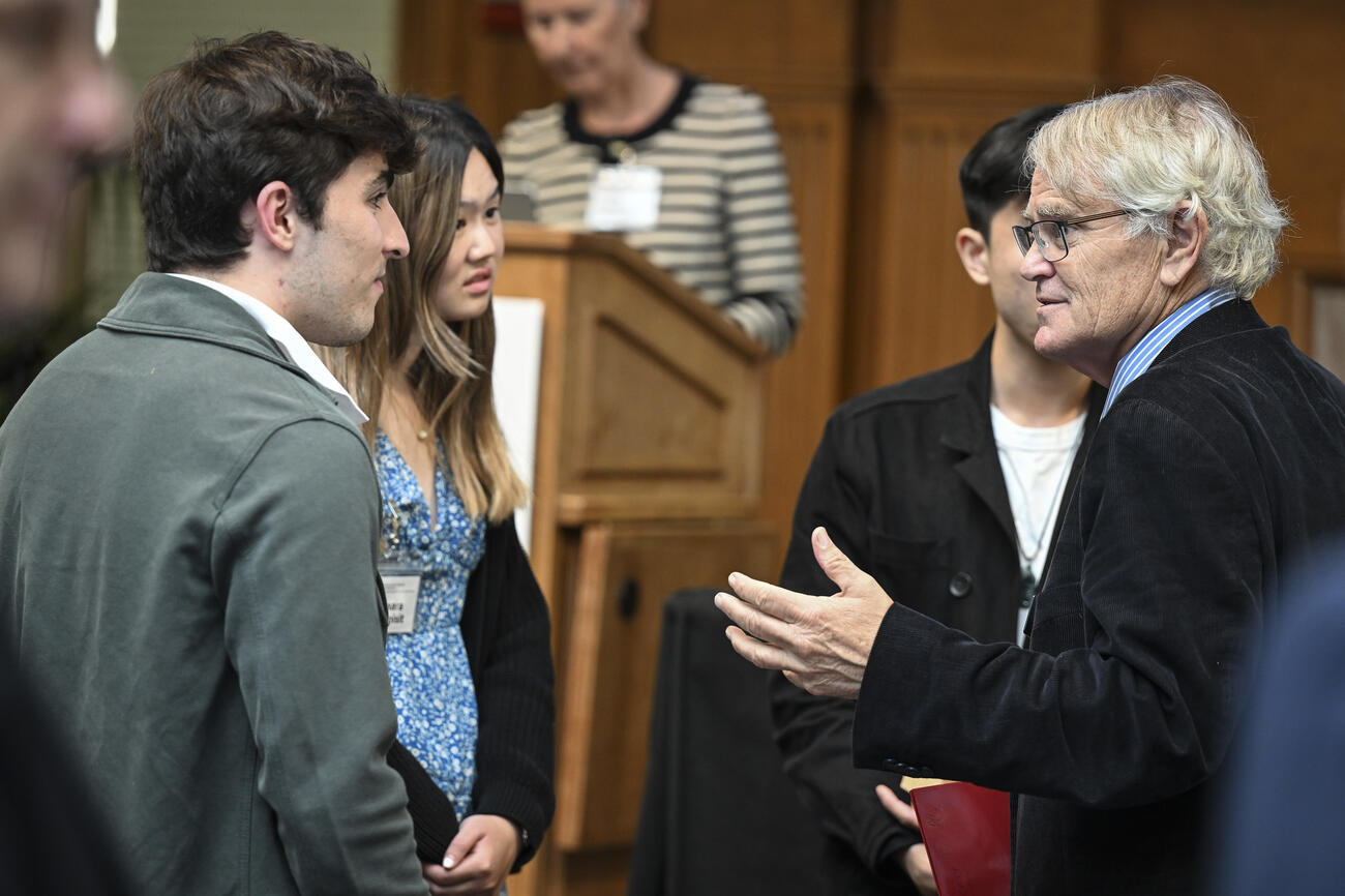 Scott Rozelle speaks with students int he audience.