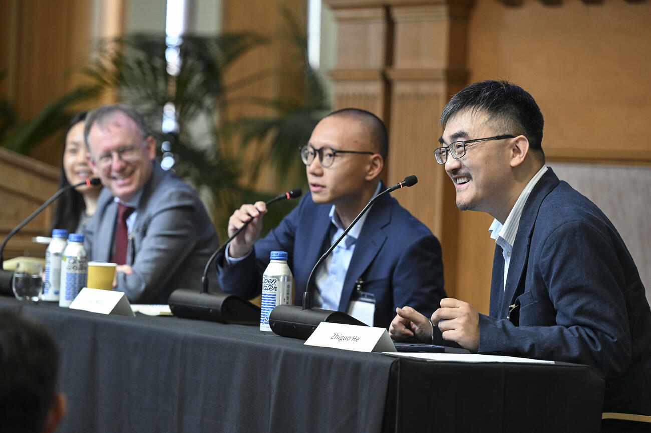 Panelists speak during a session at the 2025 SCCEI China Conference.