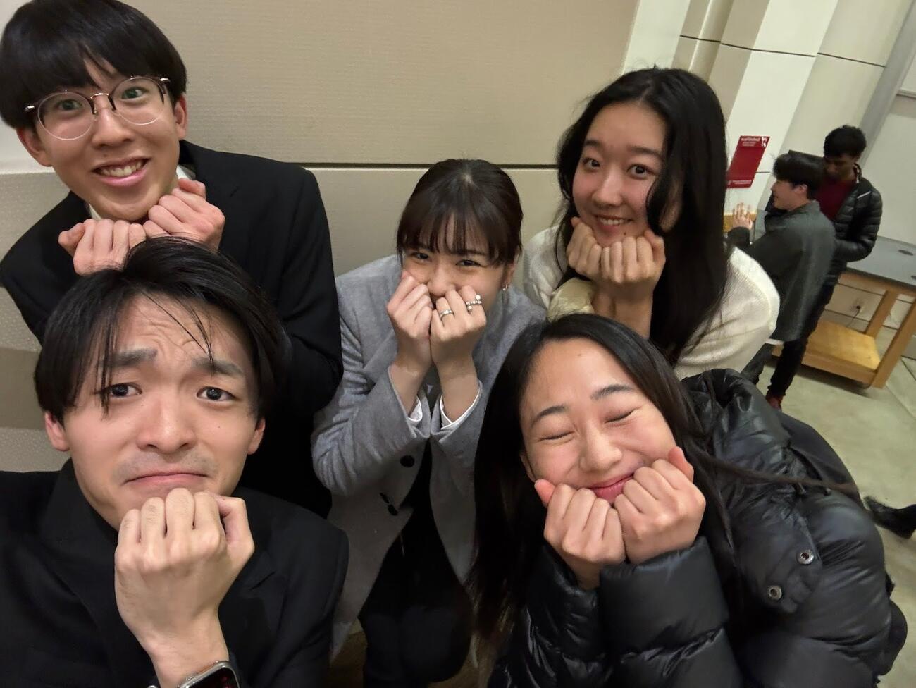 Five students from the Stanford Japan Exchange Conference pose together.