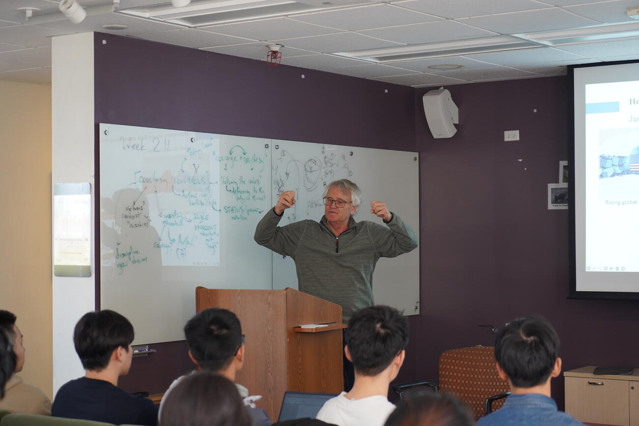 Scott Rozelle addresses a class of students.