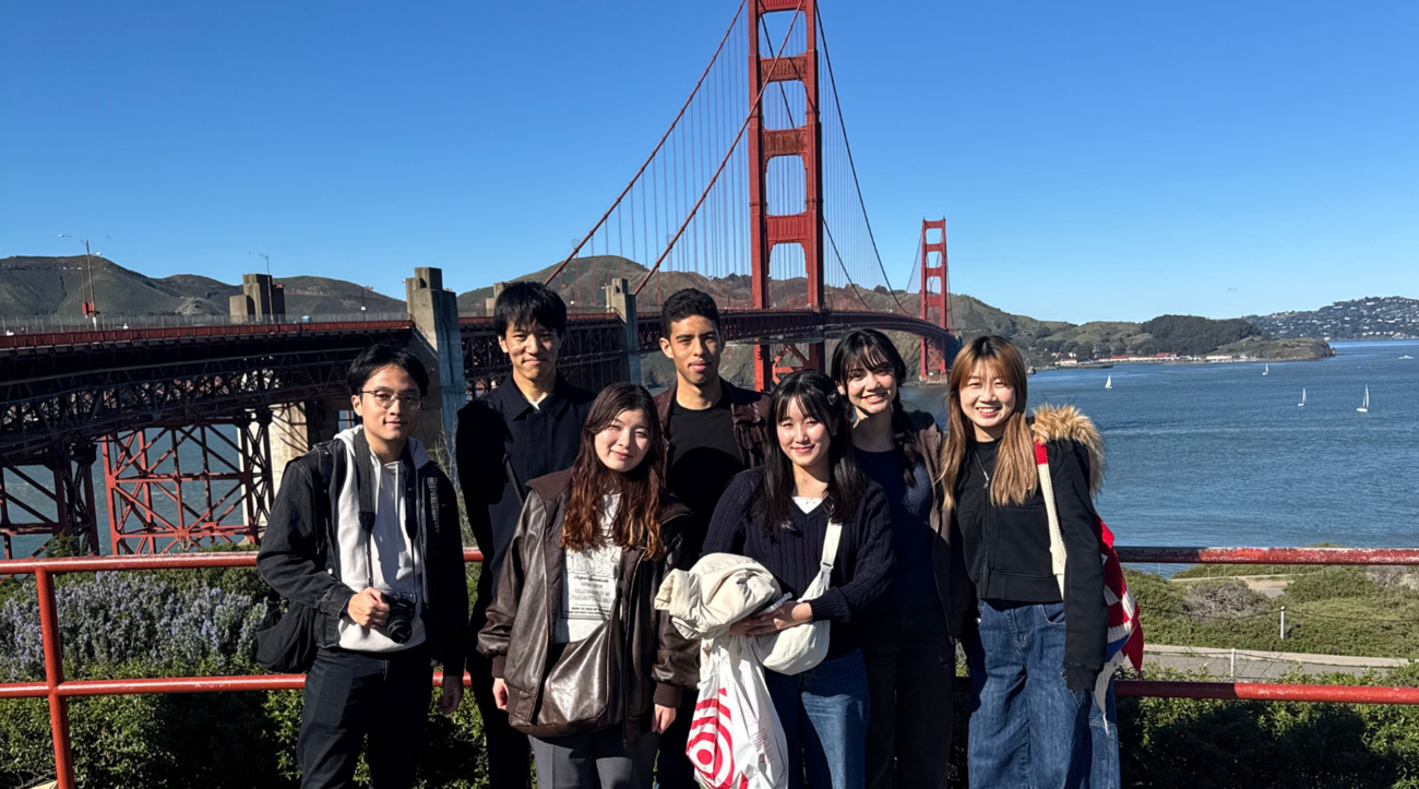 Students from the Stanford Japan Exchange Conference with the Golden Gate Bridge in the background.