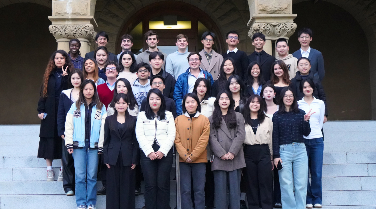 A group photo of the Forum for American-Chinese Exchange at Stanford on the front steps of Eninca Hall.