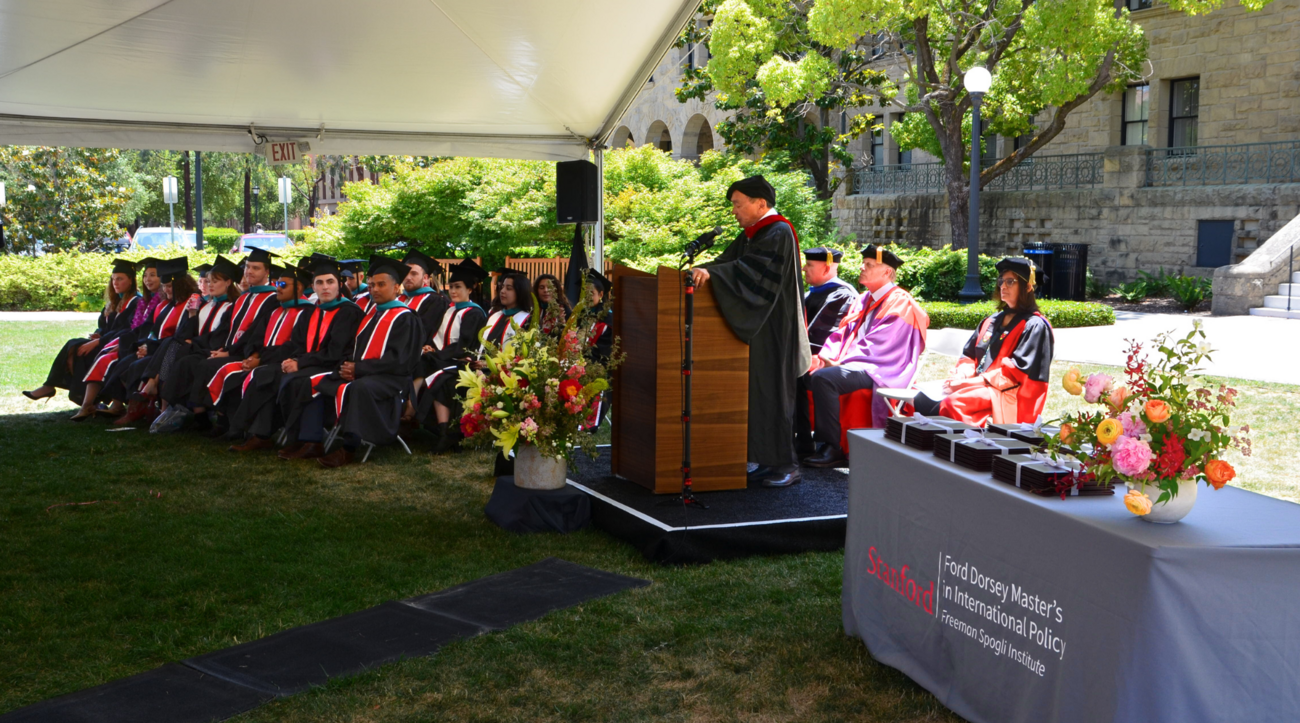 Francis Fukuyama leads the graduation ceremony of Ford Dorsey Master's in International Policy on the front lawn of Encina Hall at Stanford University.
