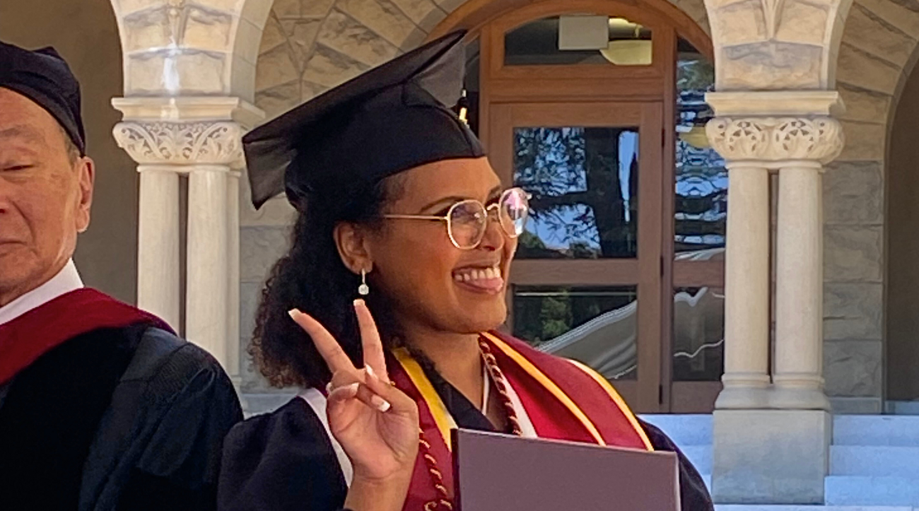 Samara Nassor poses for a candid photo in her graduation cap and gown during the diploma awarding ceremony of the Ford Dorsey Master's in International Poliy.