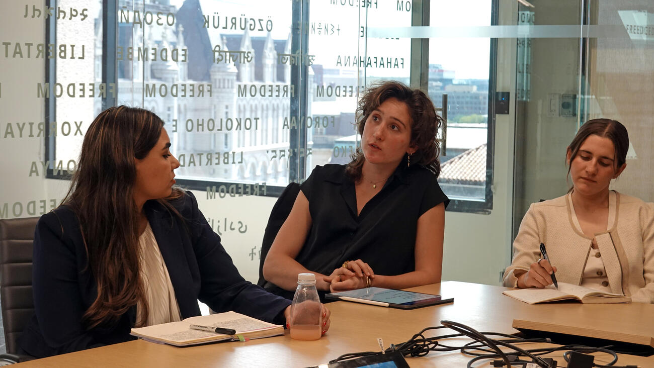 Rachel Owens asks a question during the Honor College site visit at the National Endowment for Democracy.