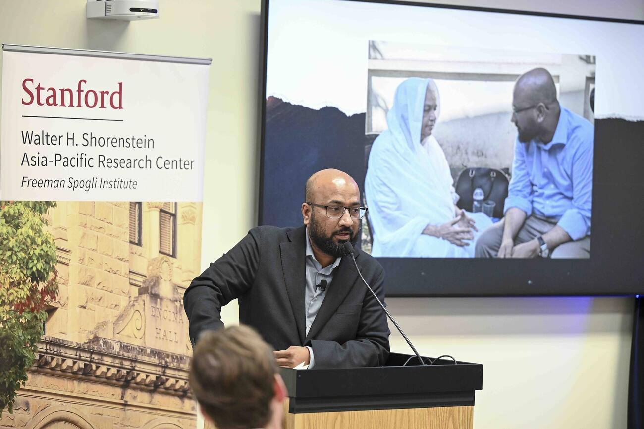 Tasneem Khalil delivers remarks at a lectern.
