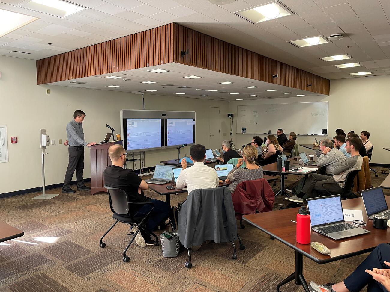 Mark Thurber teaches in front of CPUC staff