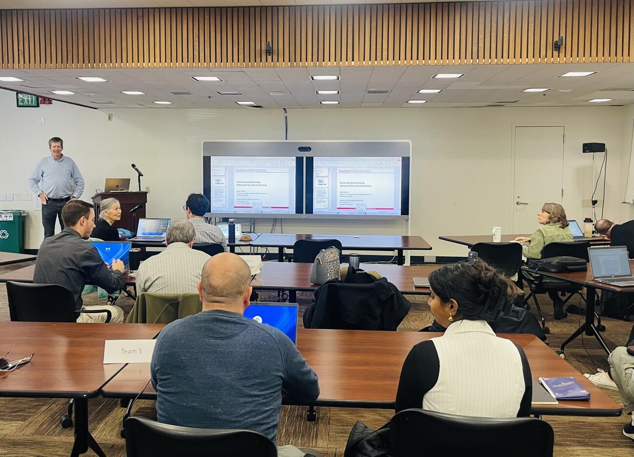 CPUC staff watch Mark Thurber present during workshop
