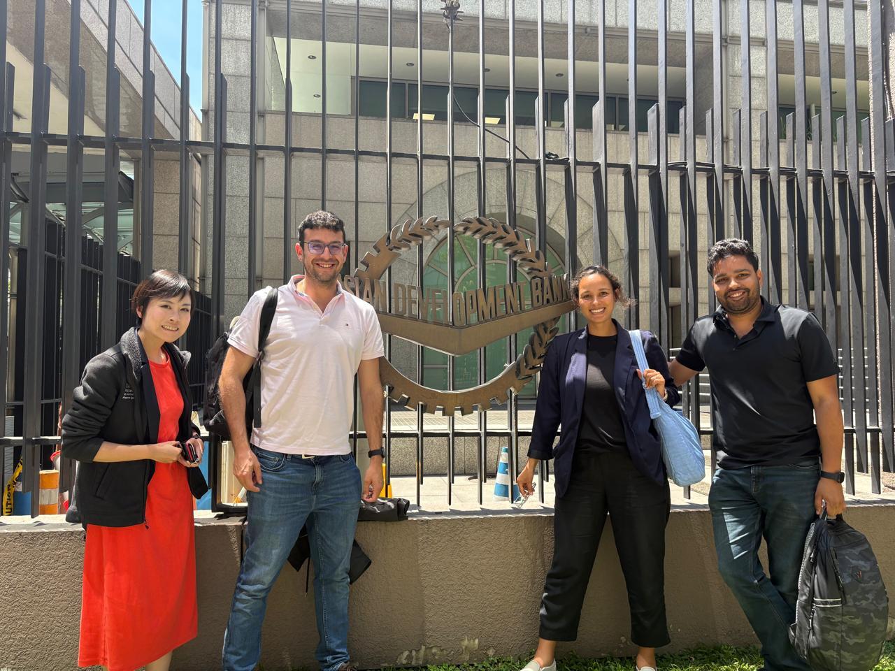 MIP students Amit Sheoran, Jennifer Eyen, Oluwafunmibi Asunmonu, Santiago Paz Ojeda, and Yukiko Ueda outside a branch of the Asian Development Bank in the Philippines.