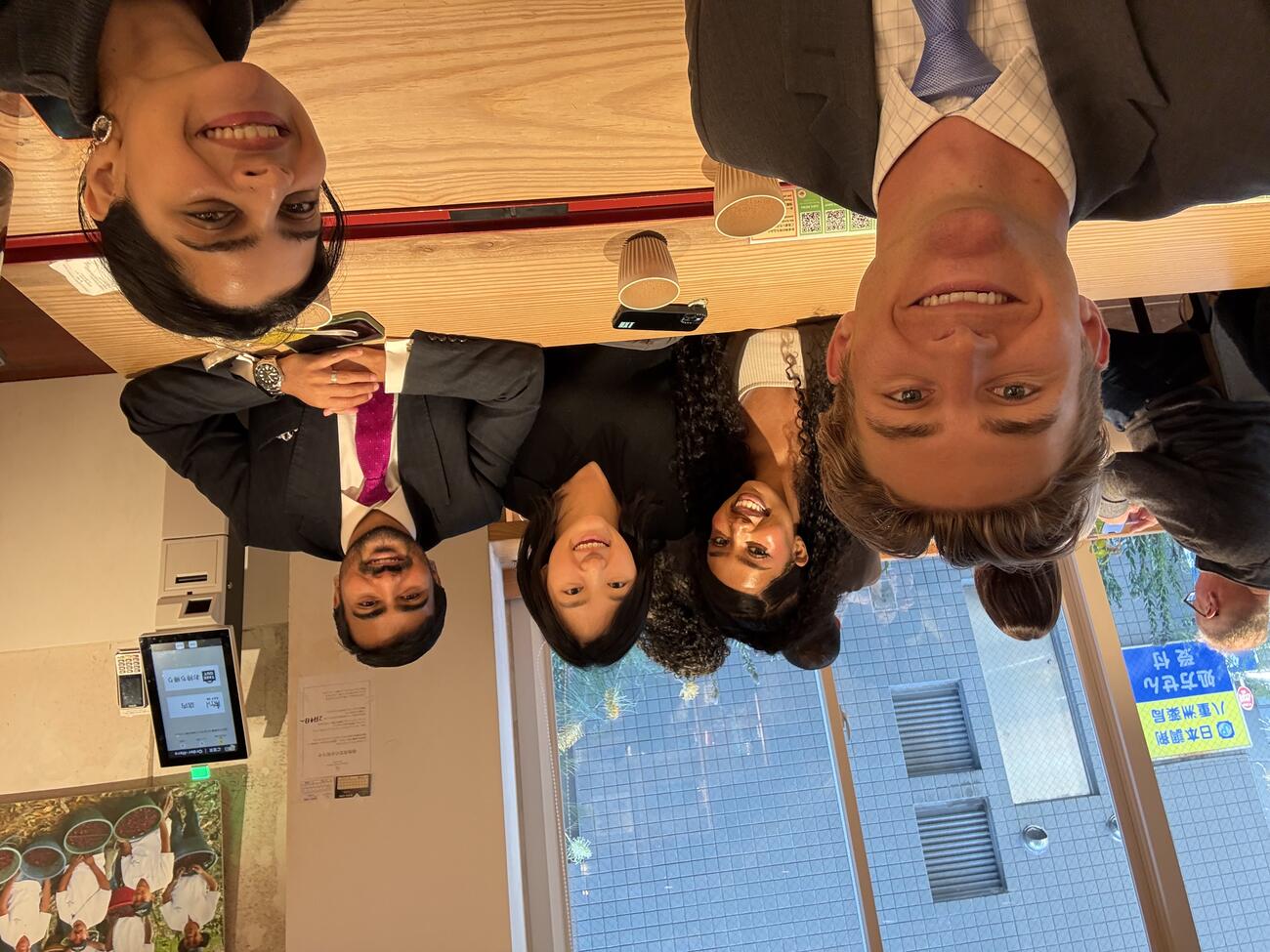 MIP students Luke Anderson, Kylie Jones, Ashraf Sabkha, Humzah Khan snap a selfie at a cafe in Tokyo, Japan.