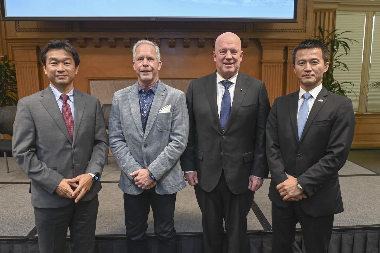 Naohiko Kohtake, Jeff Thornburg, Gen. John W. "Jay" Raymond, and Hide Kamiya pose for the camera.