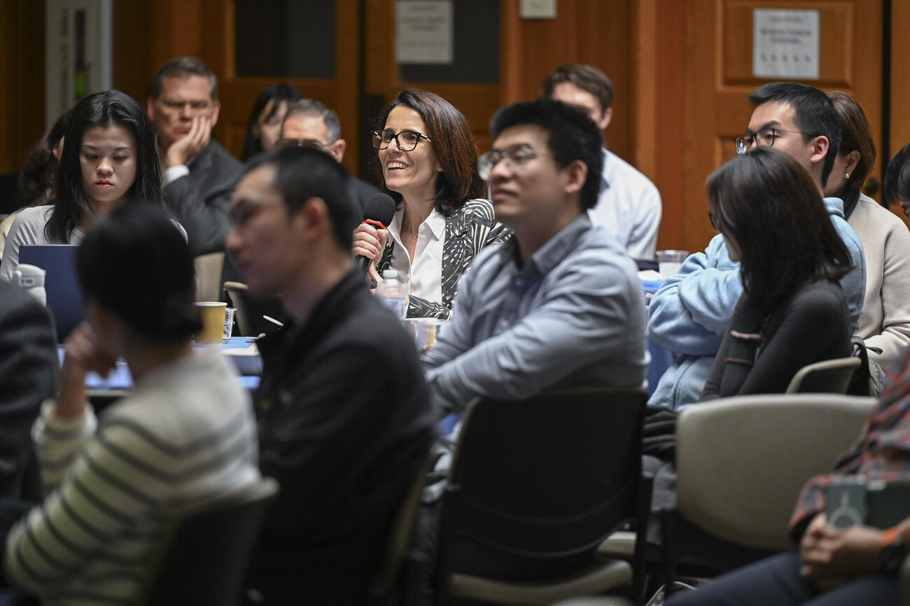 Someone asks a question from an event audience.