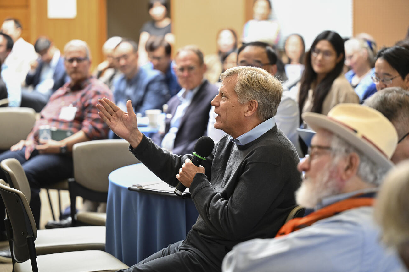 Michael McFaul asks a question for an event audience.