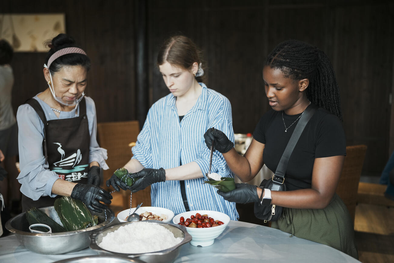 Students make Zongzi dumplings in China.