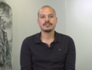 Man dressed in a black polo shirt
