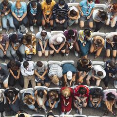 view from above of young adults sitting in rows on chairs