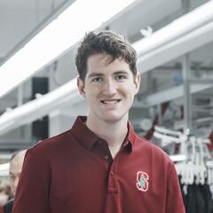 Matthew Sullivan stands in a factory.