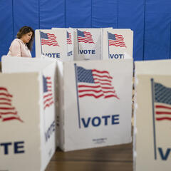 Woman at a voting machine 