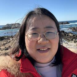 Aiqin Wang profile photo at the beach.