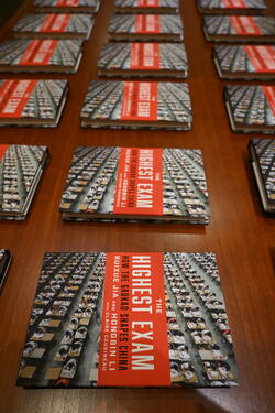 The Highest Exam books are lined up and displayed on a table.