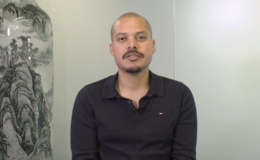 Man dressed in a black polo shirt
