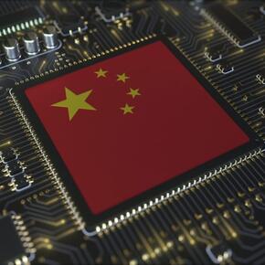 Chinese flag superimposed on computer mainframe - cover image of The Diplomat Article