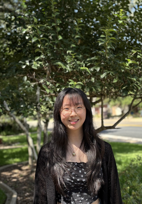 a person standing in front of trees