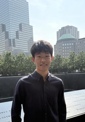 a person standing in front of buildings