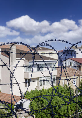 Barbed wire from correctional center and surrounding community 