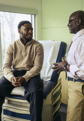 Older physician and young patient