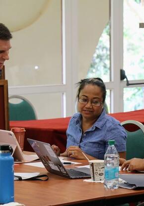 three teachers working on an activity around a table