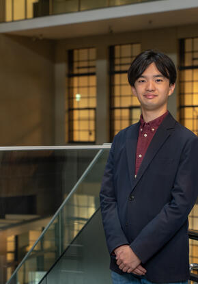 a person in a suit standing