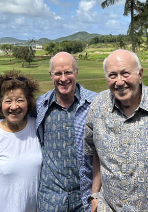 three people standing