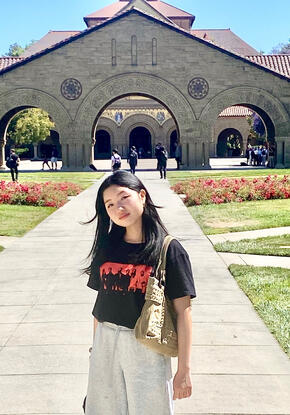 a student in front of Memorial Church during a summer program at Stanford University