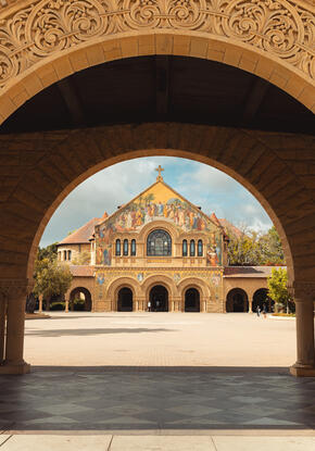 church facade appearing through an archway