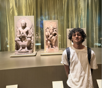 Neil Rathi with Indian statues