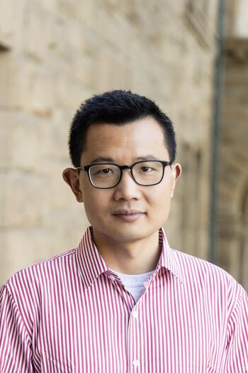 Headshot of Dr. Yiqing Xu.