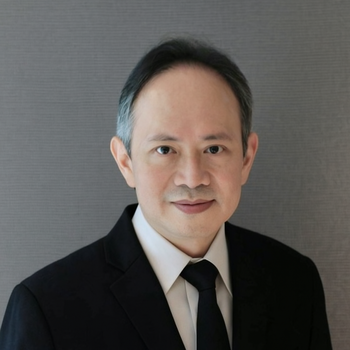 headshot photo of His Excellency, Dr. Suriya Chindawongse