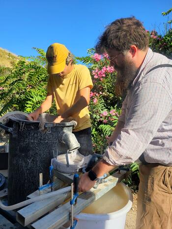 Nicholas cullen conducting flotation sampling at Segesta