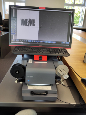 Reviewing microfilm on a computer in the German archives