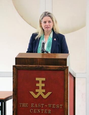 Woman speaking from a lectern