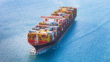 Shipping container on open sea