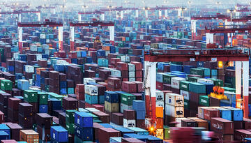 Feature figure showing vast field of shipping containers