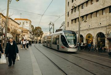 Picture of the the Jerusalem Light Rail walking up Jaffa Street. Modern face of Jerusalem, Israel.