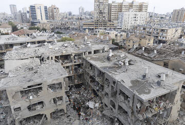 Emergency and Rescue soldiers search for trapped people inside heavily damaged buildings after an overnight missiles strike from Iran on June 15, 2025 in Bat Yam, Israel.