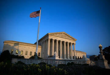 American flag in front of the Supreme Court